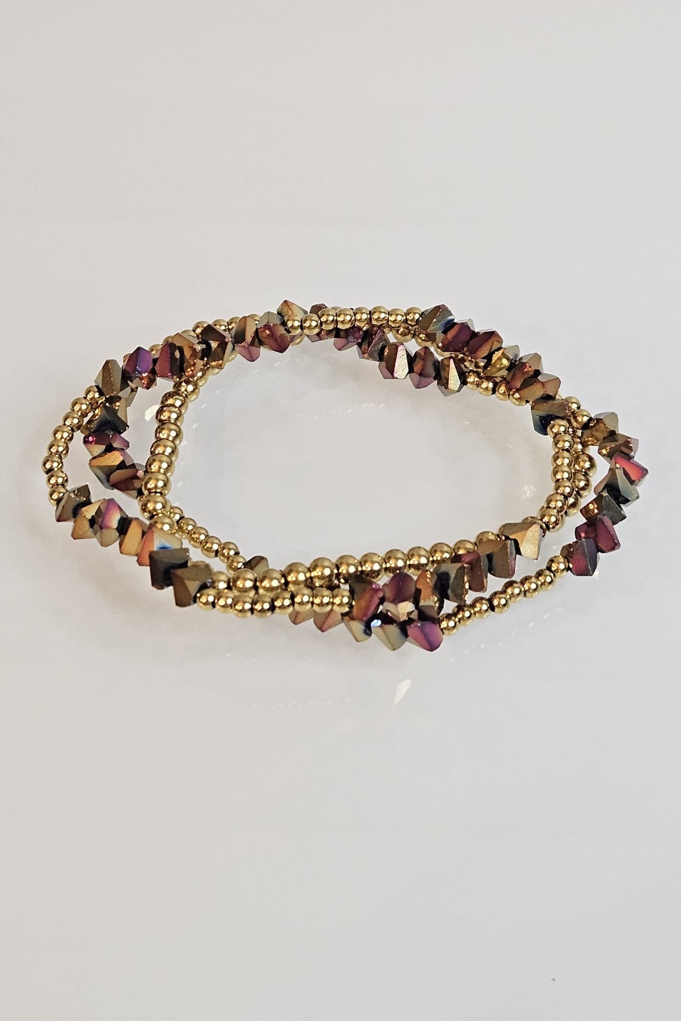 SET DE 3 PULSERAS ELÁSTICAS DORADAS Y TORNASOL