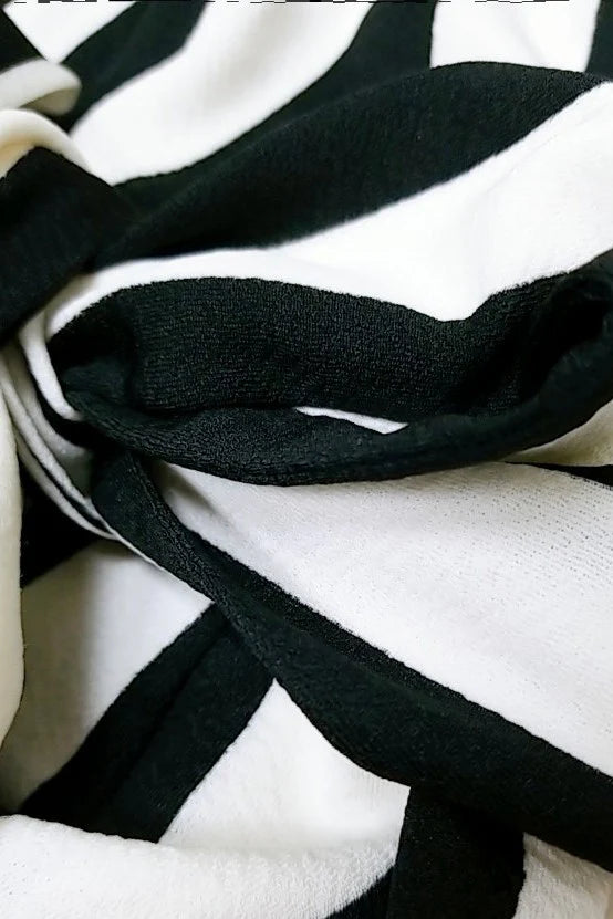 BLACK AND WHITE STRIPED ONE-SHOULDER JUMPSUIT