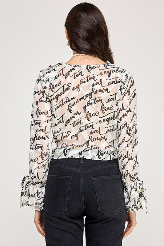 BLUSA DE MANGA LARGA BLANCO Y NEGRO CON VOLANTES