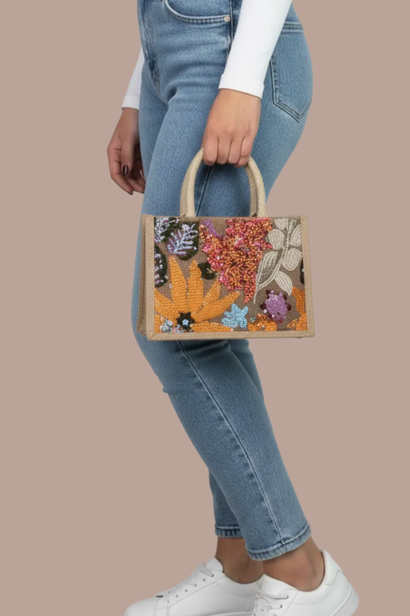 CARTERA CON DISEÑOS EN LENTEJUELAS FLORES NARANJA