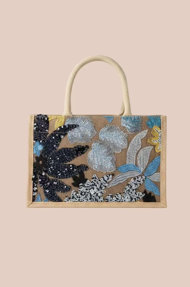CARTERA CON DISEÑOS EN LENTEJUELAS FLORES AZULES