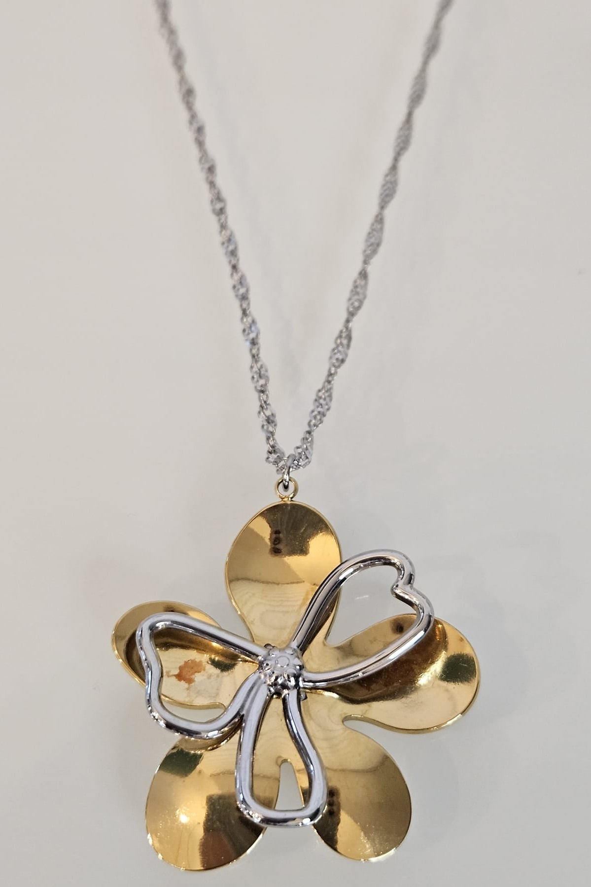 SET DE CADENA Y BRAZALETE DE FLOR DOS TONOS